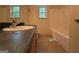 A close-up of a bathroom featuring a sink, toilet, and bathtub at 191 Tumlin Creek Rd # 1, Roopville, GA 30170