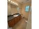 Bathroom with vanity, sink, toilet, and shower/tub combo at 191 Tumlin Creek Rd # 1, Roopville, GA 30170