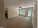 Bedroom with neutral carpet, ceiling fan, and access to a private outdoor deck at 191 Tumlin Creek Rd # 1, Roopville, GA 30170