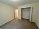 Cozy bedroom featuring carpet flooring, a closet with double doors, and a neutral color scheme at 191 Tumlin Creek Rd # 1, Roopville, GA 30170