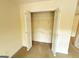 A spacious closet with double doors and shelving ready for organization and storage at 191 Tumlin Creek Rd # 1, Roopville, GA 30170