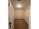 Walk-in closet with custom shelving and neutral carpeting at 191 Tumlin Creek Rd # 1, Roopville, GA 30170
