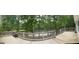 Wooden deck overlooking tranquil pond at 191 Tumlin Creek Rd # 1, Roopville, GA 30170