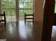 Dining area featuring a wooden table and chairs, and a large window with lake views at 191 Tumlin Creek Rd # 1, Roopville, GA 30170