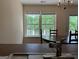 Dining area with a chandelier, table and chairs, with views of the pond at 191 Tumlin Creek Rd # 1, Roopville, GA 30170