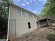 View of back of house with deck and walkout basement at 191 Tumlin Creek Rd # 1, Roopville, GA 30170