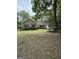 Charming single-story home showcasing a well-maintained lawn and lovely trees for enhanced curb appeal at 191 Tumlin Creek Rd # 1, Roopville, GA 30170