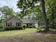 Charming single-story home showcasing a well-maintained lawn and lovely trees for enhanced curb appeal at 191 Tumlin Creek Rd # 1, Roopville, GA 30170