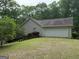 View of house with two car garage at 191 Tumlin Creek Rd # 1, Roopville, GA 30170