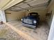 A vintage blue truck is parked inside this spacious two car garage with cement flooring at 191 Tumlin Creek Rd # 1, Roopville, GA 30170