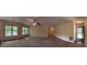 Spacious living room with large windows offering views at 191 Tumlin Creek Rd # 1, Roopville, GA 30170