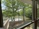Relaxing view of the pond through a window, creating a serene and peaceful ambiance at 191 Tumlin Creek Rd # 1, Roopville, GA 30170