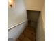 A descending wooden stairway with white banister leads to the lower level at 191 Tumlin Creek Rd # 1, Roopville, GA 30170