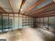 A large storage building featuring a metal roof, wooden beams, and built in shelves for organization at 191 Tumlin Creek Rd # 1, Roopville, GA 30170