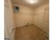 Spacious walk-in closet with shelving racks and tile flooring, offering ample storage at 191 Tumlin Creek Rd # 1, Roopville, GA 30170