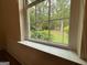 Bright window with a view of the lush green trees and foliage, bringing the outdoors inside at 191 Tumlin Creek Rd # 1, Roopville, GA 30170