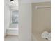 Bathroom features a window bench, and built in shelving with neutral tile at 9055 Carroll Manor Dr, Sandy Springs, GA 30350