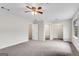 Large bedroom featuring a ceiling fan, walk in closet, and attached bathroom at 9055 Carroll Manor Dr, Sandy Springs, GA 30350
