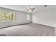 Spacious bedroom with neutral carpet, ceiling fan, and natural light from two windows at 9055 Carroll Manor Dr, Sandy Springs, GA 30350