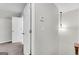 Hallway with chandelier, neutral paint and carpet, and a view to other rooms at 9055 Carroll Manor Dr, Sandy Springs, GA 30350
