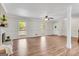 Open living area with wood floors, large windows offering natural light, and neutral wall paint at 9055 Carroll Manor Dr, Sandy Springs, GA 30350