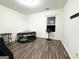 Bedroom with dark wood floors, a large window, and neutral colored walls at 2517 Oakleaf Rdg, Lithonia, GA 30058
