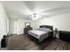 This bedroom features wood-look floors, ceiling fan, neutral paint colors, and access to the en-suite bathroom at 2517 Oakleaf Rdg, Lithonia, GA 30058