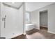 Bathroom boasting a modern tub, separate shower, and a neutral color scheme at 5326 Tolar Rd # 29, South Fulton, GA 30213