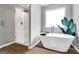 Bathroom featuring a freestanding tub, walk-in shower, and stylish finishes at 5326 Tolar Rd # 29, South Fulton, GA 30213