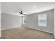 Bright bedroom featuring a ceiling fan, plush carpeting, and two large windows at 5326 Tolar Rd # 29, South Fulton, GA 30213