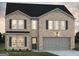 Charming two-story brick home with a two-car garage and gray accents at 5326 Tolar Rd # 29, South Fulton, GA 30213