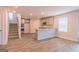Open-concept kitchen featuring granite countertops, stainless appliances, and wood-look flooring at 5326 Tolar Rd # 29, South Fulton, GA 30213