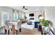 Open-concept living space with modern decor, fireplace, and bright dining area at 5326 Tolar Rd # 29, South Fulton, GA 30213