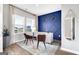 Stylish office space featuring a blue accent wall, modern desk, and natural light at 5326 Tolar Rd # 29, South Fulton, GA 30213