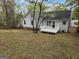 Backyard featuring a well-maintained lawn, a deck, and the home's exterior at 4687 Sterling Pointe Ct, Douglasville, GA 30135