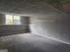 Finished basement offers ample space for recreation and relaxation with a window for light at 4687 Sterling Pointe Ct, Douglasville, GA 30135