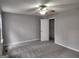 Spacious bedroom with ceiling fan and a walk-in closet providing ample storage at 4687 Sterling Pointe Ct, Douglasville, GA 30135