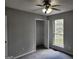 Bedroom with natural light through a window and closet with shelving for organized storage at 4687 Sterling Pointe Ct, Douglasville, GA 30135