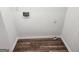Utility room featuring hookups for a washer and dryer, as well as updated flooring at 4687 Sterling Pointe Ct, Douglasville, GA 30135