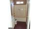 Bathroom with shower-tub combination and striped walls at 172 Willow Springs Ln, Stockbridge, GA 30281