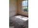 Bedroom featuring carpet flooring, a window with a view, and electrical outlet at 172 Willow Springs Ln, Stockbridge, GA 30281