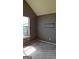 Bedroom with carpet, large window, and dark-colored walls at 172 Willow Springs Ln, Stockbridge, GA 30281