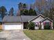 Charming single-story home with a two-car garage and manicured lawn at 172 Willow Springs Ln, Stockbridge, GA 30281