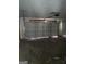 View of a 2 car garage with white door and a single light fixture at 172 Willow Springs Ln, Stockbridge, GA 30281
