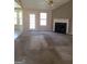 View of the living room showing a white mantle over a green-tiled fireplace at 172 Willow Springs Ln, Stockbridge, GA 30281