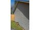 Property side showing vinyl siding with wood privacy fence, perfect for enjoying outdoor space at 172 Willow Springs Ln, Stockbridge, GA 30281