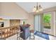 Cozy breakfast nook with a high-top table, bar stools, and access to a deck at 3121 Cruse Rd, Lawrenceville, GA 30044