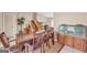 Open dining room with a wooden table, access to a staircase, and tiled floors at 3121 Cruse Rd, Lawrenceville, GA 30044