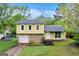 Charming two-story home with a stone facade, attached garage, and a well-maintained front yard at 3121 Cruse Rd, Lawrenceville, GA 30044