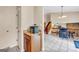Bright kitchenette with wood cabinets, and access to the living room and staircase at 3121 Cruse Rd, Lawrenceville, GA 30044